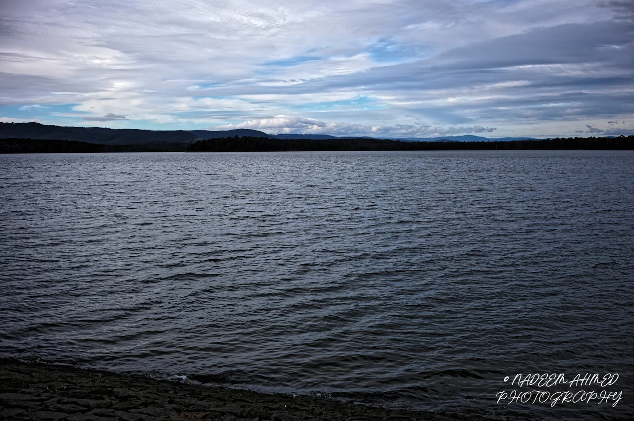 Rippled lake under a layered blue and white sky, photographed with the Leica M11-P and Summilux-M 35mm f/1.4 ASPH.